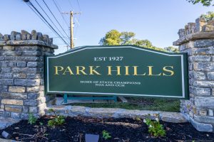 Park Hills sign framed by stone pillars reads EST 1927; home of state champions NDA and CCH.